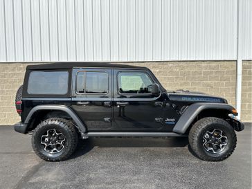 2021 Jeep Wrangler 4xE Unlimited Rubicon in a Black Clear Coat exterior color and Blackinterior. Wilmington Auto Center Chrysler Dodge Jeep Ram (937) 556-6430 wilmingtonautocentercdjr.com 