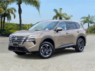 Used 2024 Nissan Rogue FWD SV in a Baja Storm Metallic exterior color and Charcoalinterior. Southbay Chrysler Jeep Dodge Ram (424) 404-5521 pixelmotiondemo.com 