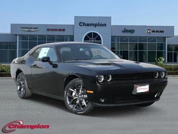 2023 Dodge Challenger SXT in a Pitch-Black exterior color and NAPPA LEATHERinterior. Champion Chrysler Jeep Dodge Ram 800-549-1084 pixelmotiondemo.com 