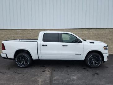 2025 RAM 1500 Big Horn Crew Cab 4x4 5'7' Box in a Bright White Clear Coat exterior color and Blackinterior. Wilmington Auto Center Chrysler Dodge Jeep Ram (937) 556-6430 wilmingtonautocentercdjr.com 