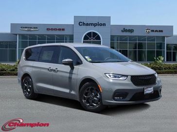 2023 Chrysler Pacifica Plug-in Hybrid Touring L in a Ceramic Gray Clear Coat exterior color and CAPRICE LEATHERinterior. Champion Chrysler Jeep Dodge Ram 800-549-1084 pixelmotiondemo.com 