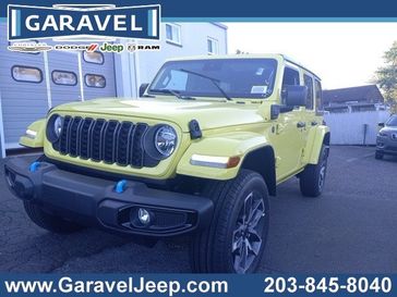 2024 Jeep Wrangler 4-door Sport S 4xe in a High Velocity Clear Coat exterior color and Blackinterior. Garavel Jeep 475-258-7987 norwalkjeep.com 