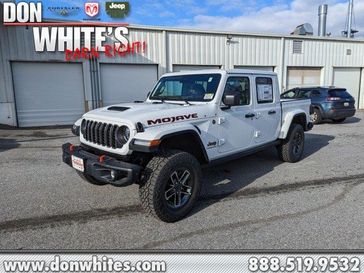 2024 Jeep GLADIATOR MOJAVE X 4X4 in a Bright White Clear Coat exterior color. Don White's Timonium Chrysler Dodge Jeep Ram 410-881-5409 donwhites.com 