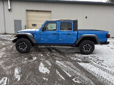 2023 Jeep Gladiator Rubicon 4x4 in a Hydro Blue Pearl Coat exterior color and Blackinterior. Victor Chrysler Dodge Jeep Ram 585-236-4391 victorcdjr.com 