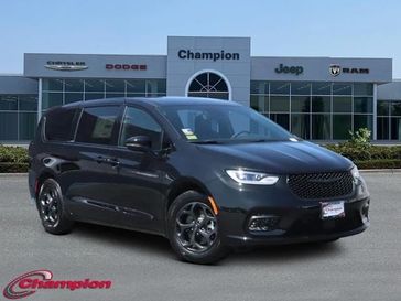 2023 Chrysler Pacifica Plug-in Hybrid Touring L in a Brilliant Black Crystal Pearl Coat exterior color and CAPRICEinterior. Champion Chrysler Jeep Dodge Ram 800-549-1084 pixelmotiondemo.com 