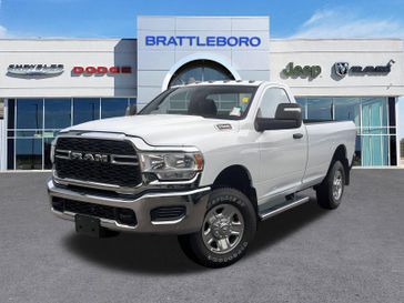 2024 RAM 2500 Tradesman Regular Cab 4x4 8' Box in a Bright White Clear Coat exterior color and Diesel Gray/Blackinterior. Brattleboro CDJR 802-251-1111 brattleborocdjr.com 