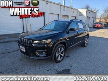 2022 Jeep Cherokee Limited in a Diamond Black Crystal Pearl Coat exterior color and Blackinterior. Don White's Timonium Chrysler Dodge Jeep Ram 410-881-5409 donwhites.com 