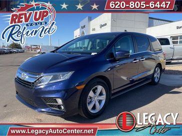 2019 Honda Odyssey EX-L in a Obsidian Blue Pearl exterior color and Grayinterior. Legacy Auto Center 620-315-9264 legacyautocenter.net 