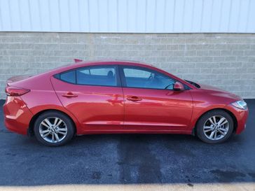 2017 Hyundai Elantra Value Edition in a Scarlet Red exterior color and Blackinterior. Wilmington Auto Center Chrysler Dodge Jeep Ram (937) 556-6430 wilmingtonautocentercdjr.com 