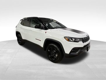 2024 Jeep Compass Trailhawk 4x4 in a Bright White Clear Coat exterior color and Ruby Red/Blackinterior. Sheridan Motors CDJR 307-218-2217 sheridanmotor.com 