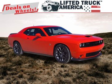 2023 Dodge Challenger R/T Scat Pack in a Go Mango exterior color and Blackinterior. Lifted Truck America 888-267-0644 liftedtruckamerica.com 