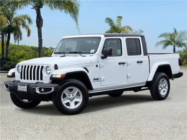 Used 2022 Jeep Gladiator Sport S 4x4 in a Bright White Clear Coat exterior color and Heritage Tan/Blackinterior. Southbay Chrysler Jeep Dodge Ram (424) 404-5521 pixelmotiondemo.com 