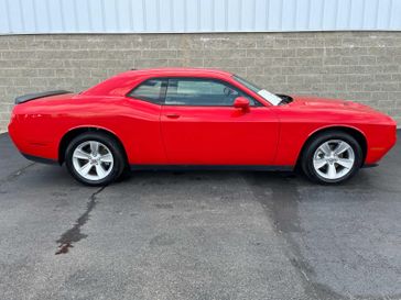 2023 Dodge Challenger SXT in a Torred Clear Coat exterior color and Blackinterior. Wilmington Auto Center Chrysler Dodge Jeep Ram (937) 556-6430 wilmingtonautocentercdjr.com 