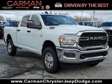 2024 RAM 3500 Tradesman Crew Cab 4x4 6'4' Box in a Bright White Clear Coat exterior color and Blackinterior. Carman Chrysler Jeep Dodge Ram 302-317-2378 carmanchryslerjeepdodge.com 