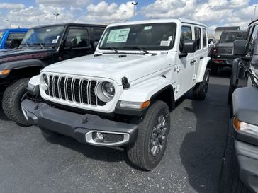 2024 Jeep Wrangler 4-door Sahara in a Bright White Clear Coat exterior color. Gupton Motors Inc 615-384-2886 guptonmotors.com 