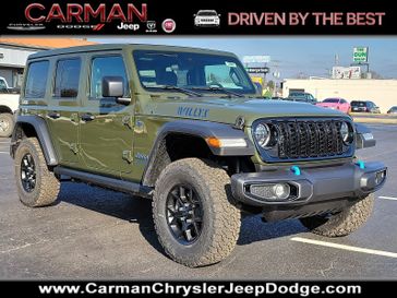 2024 Jeep Wrangler 4-door Willys 4xe in a Sarge Green Clear Coat exterior color and Black - E7X9interior. Carman Chrysler Jeep Dodge Ram 302-317-2378 carmanchryslerjeepdodge.com 
