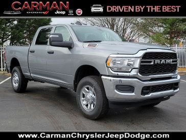 2024 RAM 2500 Tradesman Crew Cab 4x4 6'4' Box in a Billet Silver Metallic Clear Coat exterior color and Black - V9X9interior. Carman Chrysler Jeep Dodge Ram 302-317-2378 carmanchryslerjeepdodge.com 
