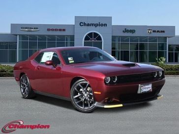 2023 Dodge Challenger Gt in a Octane Red exterior color and HOUNDSTOOTHinterior. Champion Chrysler Jeep Dodge Ram 800-549-1084 pixelmotiondemo.com 