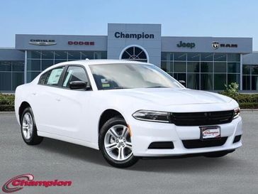 2023 Dodge Charger SXT Rwd in a White Knuckle exterior color and HOUNDSTOOTHinterior. Champion Chrysler Jeep Dodge Ram 800-549-1084 pixelmotiondemo.com 
