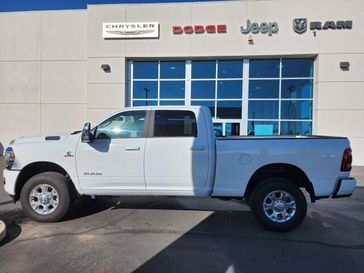 2024 RAM 2500 Laramie in a BRIGHT WHITE CLEAR Coat exterior color and Blackinterior. Lampe Chrysler Dodge Jeep RAM 559-471-3085 pixelmotiondemo.com 