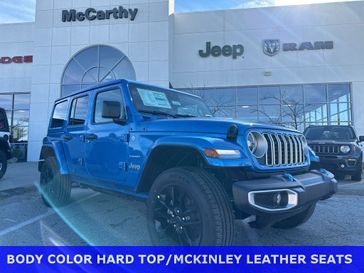 2024 Jeep Wrangler 4-door Sahara 4xe in a Hydro Blue Pearl Coat exterior color and Blackinterior. McCarthy Jeep Ram 816-434-0674 mccarthyjeepram.com 