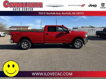 2024 RAM 3500 Big Horn in a Flame Red Clear Coat exterior color and Diesel Gray/Blackinterior. Cornhusker Auto Center 402-866-8665 cornhuskerautocenter.com 