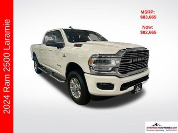 2024 RAM 2500 Laramie Crew Cab 4x4 6'4' Box in a Pearl White exterior color and Blackinterior. Sheridan Motors CDJR 307-218-2217 sheridanmotor.com 