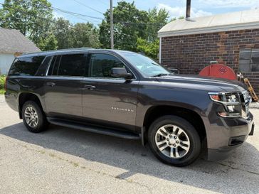 2015 Chevrolet Suburban 1500  in a GRAY exterior color. Hometown Motors of Rockwell City 712-220-7644 hometownmotorsrc.com 