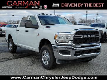 2024 RAM 3500 Tradesman Crew Cab 4x4 6'4' Box in a Bright White Clear Coat exterior color and Blackinterior. Carman Chrysler Jeep Dodge Ram 302-317-2378 carmanchryslerjeepdodge.com 