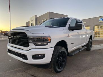 2024 RAM 2500 Laramie Crew Cab 4x4 6'4' Box in a Bright White Clear Coat exterior color and Blackinterior. Legacy Auto Center 620-315-9264 legacyautocenter.net 