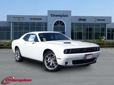 2023 Dodge Challenger SXT in a White Knuckle exterior color and NAPPA LTHR SPRTinterior. Champion Chrysler Jeep Dodge Ram 800-549-1084 pixelmotiondemo.com 