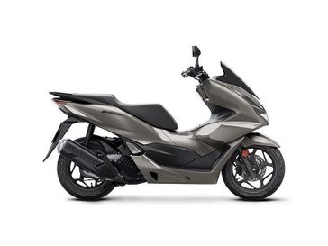 2023 Honda PCX in a Matte Brown Met exterior color. New England Powersports 978 338-8990 pixelmotiondemo.com 