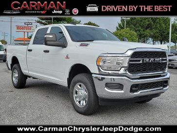 2024 RAM 2500 Tradesman Crew Cab 4x4 6'4' Box in a Bright White Clear Coat exterior color and Black - V9X9interior. Carman Chrysler Jeep Dodge Ram 302-317-2378 carmanchryslerjeepdodge.com 