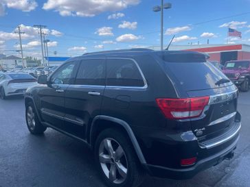 2011 Jeep Grand Cherokee Overland in a Brilliant Black Crystal Pearl exterior color and Black/New Saddle Interiorinterior. Wilmington Auto Center Chrysler Dodge Jeep Ram (937) 556-6430 wilmingtonautocentercdjr.com 