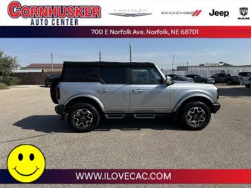 2022 Ford Bronco Outer Banks in a Iconic Silver Metallic exterior color and Dark Gray w/Navy Pierinterior. Cornhusker Auto Center 402-866-8665 cornhuskerautocenter.com 