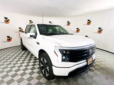 2024 Ford F-150 Lightning Platinum in a Star White Metallic Tri Coat exterior color and Blackinterior. Ontario Auto Center ontarioautocenter.com 