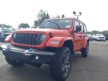 2024 Jeep Wrangler 4-door Sport S 4xe in a Firecracker Red Clear Coat exterior color and Blackinterior. Garavel Jeep 475-258-7987 norwalkjeep.com 