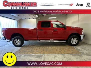 2024 RAM 3500 Tradesman in a Flame Red Clear Coat exterior color and Blackinterior. Cornhusker Auto Center 402-866-8665 cornhuskerautocenter.com 