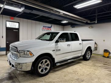 Used 2017 RAM 1500 Laramie in a Bright White Clear Coat exterior color and Canyon Brown/Light Frost Beigeinterior. Jensen Chrysler Dodge Jeep Ram 507-354-0542 jensenchryslerdodgejeepram.com 