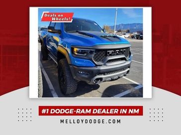 2022 RAM 1500 TRX in a Hydro Blue Pearl Coat exterior color and Blackinterior. Melloy Dodge RAM FIAT 505-588-4459 melloydodge.com 