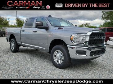 2024 RAM 2500 Tradesman Crew Cab 4x4 6'4' Box in a Billet Silver Metallic Clear Coat exterior color and Black - V9X9interior. Carman Chrysler Jeep Dodge Ram 302-317-2378 carmanchryslerjeepdodge.com 