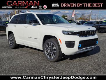 2022 Jeep Grand Cherokee Overland 4xe in a Bright White Clear Coat exterior color and Steel Gray/Global Blackinterior. Carman Chrysler Jeep Dodge Ram 302-317-2378 carmanchryslerjeepdodge.com 