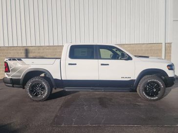 2025 RAM 1500 Rebel Crew Cab 4x4 5'7' Box in a Bright White Clear Coat exterior color and Blackinterior. Wilmington Auto Center Chrysler Dodge Jeep Ram (937) 556-6430 wilmingtonautocentercdjr.com 