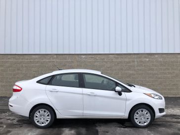 2019 Ford Fiesta S in a Oxford White exterior color and Charcoal Blackinterior. Wilmington Auto Center Chrysler Dodge Jeep Ram (937) 556-6430 wilmingtonautocentercdjr.com 