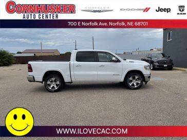 2022 RAM 1500 Laramie Crew Cab 4x4 5'7' Box in a Ivory White Tri Coat Pearl Coat exterior color and Blackinterior. Cornhusker Auto Center 402-866-8665 cornhuskerautocenter.com 