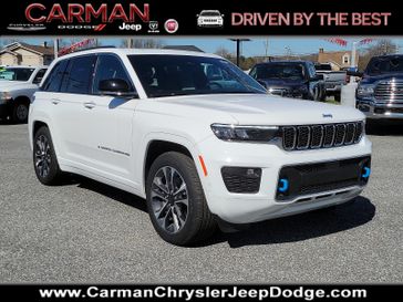 2023 Jeep Grand Cherokee Overland 4xe in a Bright White Clear Coat exterior color and Global Blackinterior. Carman Chrysler Jeep Dodge Ram 302-317-2378 carmanchryslerjeepdodge.com 