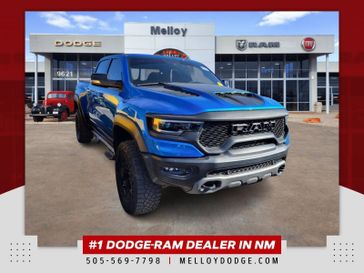 2022 RAM 1500 TRX in a Hydro Blue Pearl Coat exterior color and Blackinterior. Melloy Dodge RAM FIAT 505-588-4459 melloydodge.com 