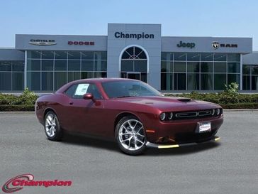 2023 Dodge Challenger Gt in a Octane Red exterior color and HOUNDSTOOTHinterior. Champion Chrysler Jeep Dodge Ram 800-549-1084 pixelmotiondemo.com 