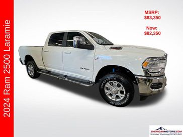 2024 RAM 2500 Laramie Crew Cab 4x4 6'4' Box in a Pearl White exterior color and Blackinterior. Sheridan Motors Auto (307) 218-2217 sheridanmotors.com 