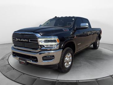 Used 2022 RAM 3500 Laramie in a Diamond Black Crystal Pearl Coat exterior color and Light Frost Beige/Mountain Browninterior. Perkins La Junta 719-383-2250 perkinslajunta.com 